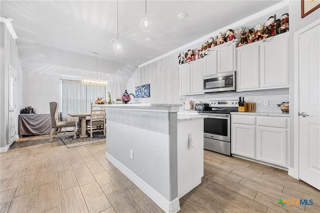 1211 Liberation Ln, Copperas Cove, TX 76522 - kitchen with stainless steel appliances, a chandelier, backsplash, white cabinetry, and ornamental molding