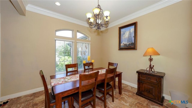 dining area featuring a chandelier, crown molding, baseboards, and stone finish floors
