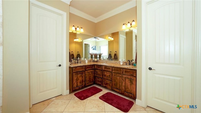bathroom with ornamental molding, double vanity, and tile patterned floors
