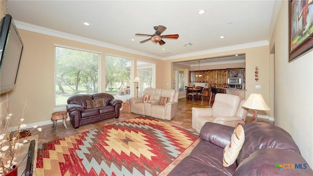 living area featuring ceiling fan, light tile patterned flooring, ornamental molding, baseboards, and recessed lighting