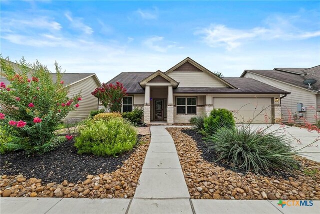 834 Wall St, New Braunfels, TX 78130 - view of front of property featuring a garage, concrete driveway, and roof with shingles
