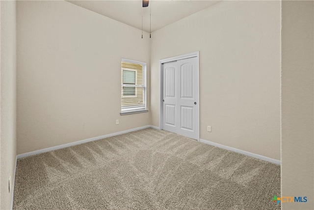834 Wall St, New Braunfels, TX 78130 - carpeted spare room with baseboards and a ceiling fan