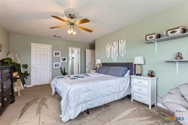 4201 Breckenridge Dr, Killeen, TX 76542 - bedroom with light carpet, ceiling fan, and a textured ceiling