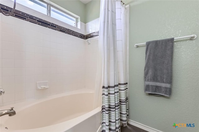4201 Breckenridge Dr, Killeen, TX 76542 - full bathroom featuring shower / bath combo with shower curtain and a textured wall