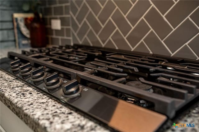 interior details featuring black gas stovetop