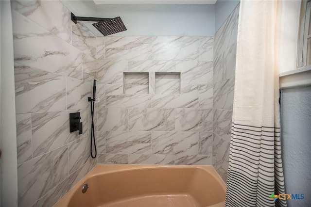 bathroom featuring washtub / shower combination