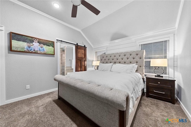 carpeted bedroom with ornamental molding, vaulted ceiling, baseboards, and a barn door