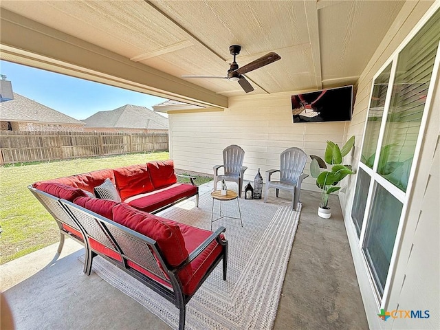 view of patio with ceiling fan, fence, and an outdoor hangout area