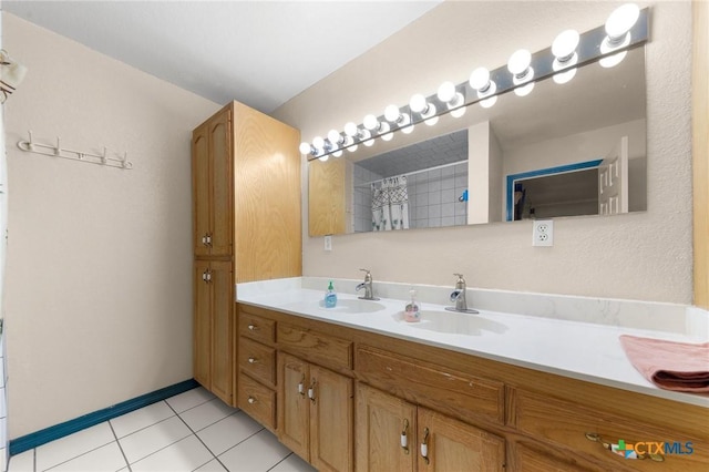 bathroom featuring vanity, tile patterned flooring, and a shower with shower curtain