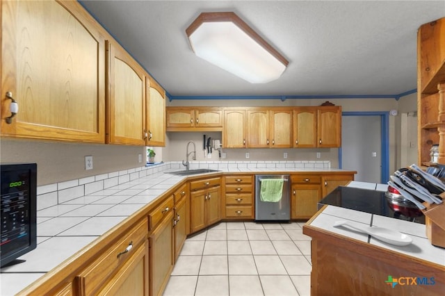 kitchen featuring dishwasher, tile countertops, a sink, light tile patterned flooring, and black microwave