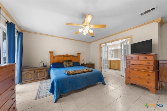 bedroom featuring visible vents, crown molding, and light tile patterned floors