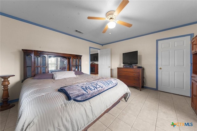 bedroom featuring ceiling fan, visible vents, ornamental molding, and light tile patterned floors
