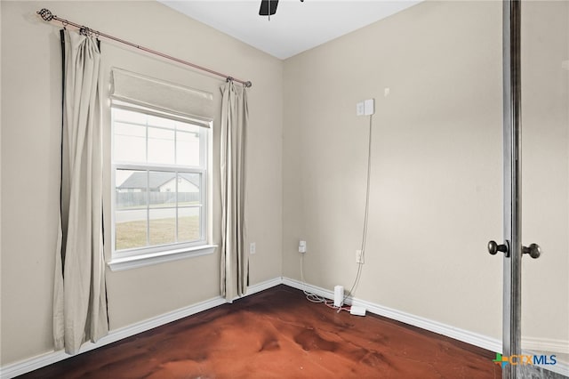 spare room with ceiling fan