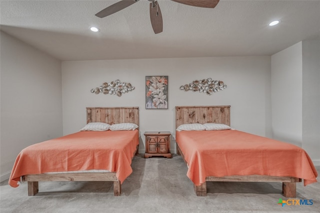 bedroom with carpet flooring, a textured ceiling, and ceiling fan