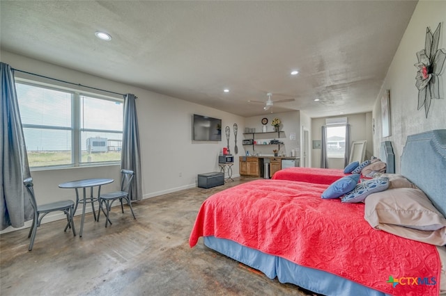 bedroom featuring concrete floors