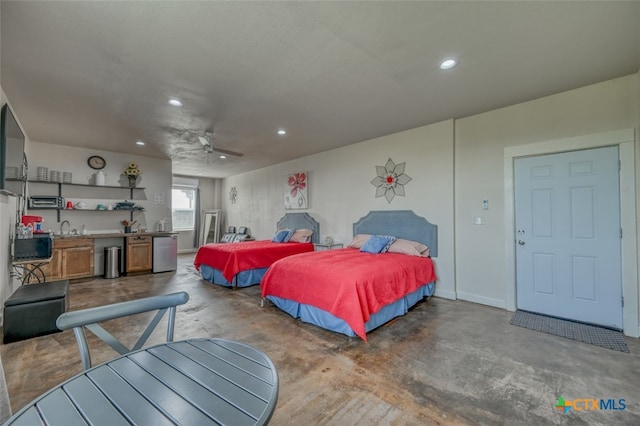 bedroom with ceiling fan and sink