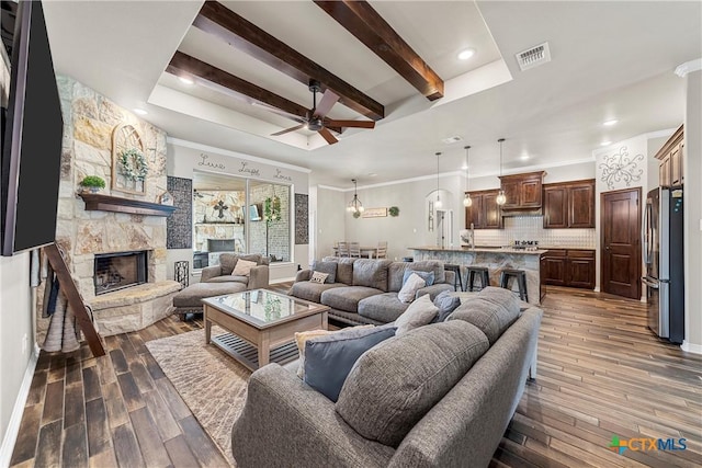 6 Salta Ct, Belton, TX 76513 - living room featuring ceiling fan, dark wood-style floors, a fireplace, beamed ceiling, and recessed lighting