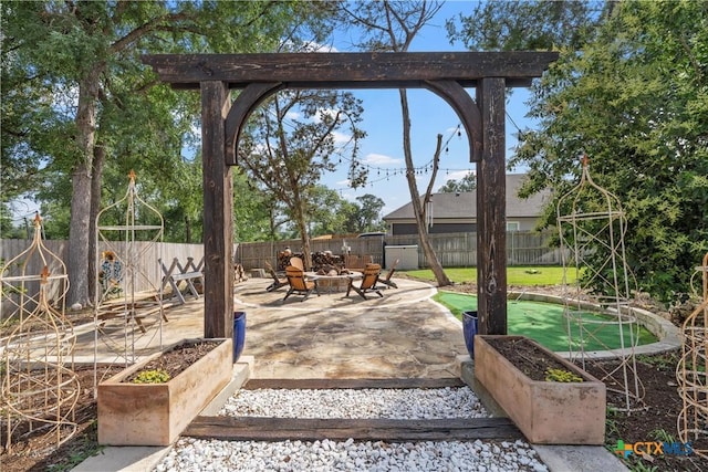 6 Salta Ct, Belton, TX 76513 - view of patio / terrace with a fire pit, a putting area, and a fenced backyard