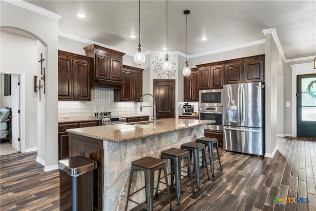 6 Salta Ct, Belton, TX 76513 - kitchen featuring stainless steel appliances, a sink, dark wood-style flooring, baseboards, and recessed lighting