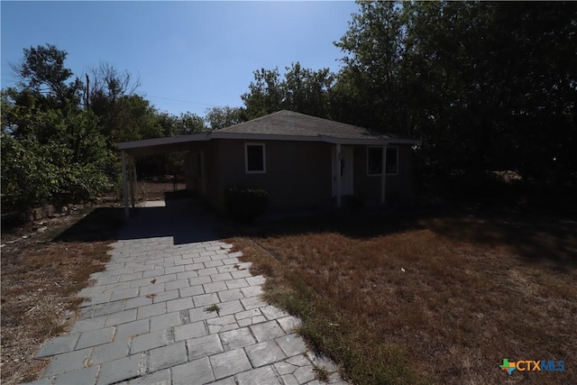 view of front of property with a carport