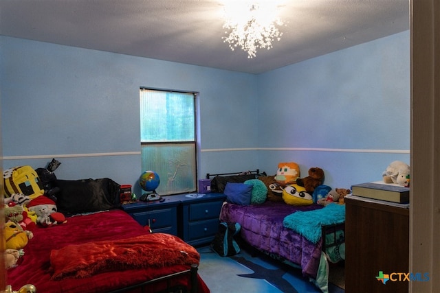 carpeted bedroom featuring a notable chandelier