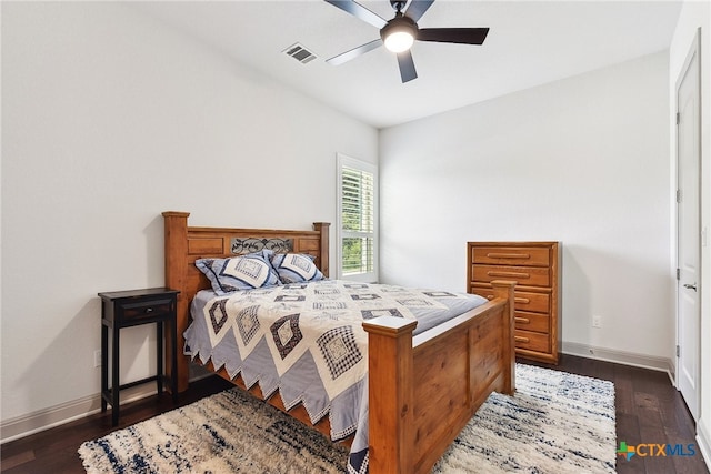 bedroom featuring dark hardwood / wood-style floors and ceiling fan