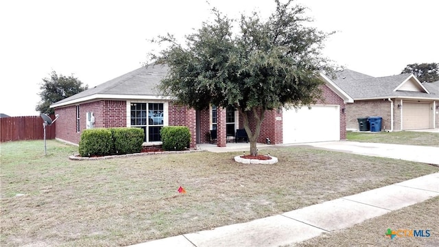 view of front of house with a front yard and a garage