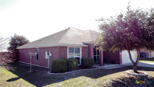 view of property exterior featuring a yard and a garage