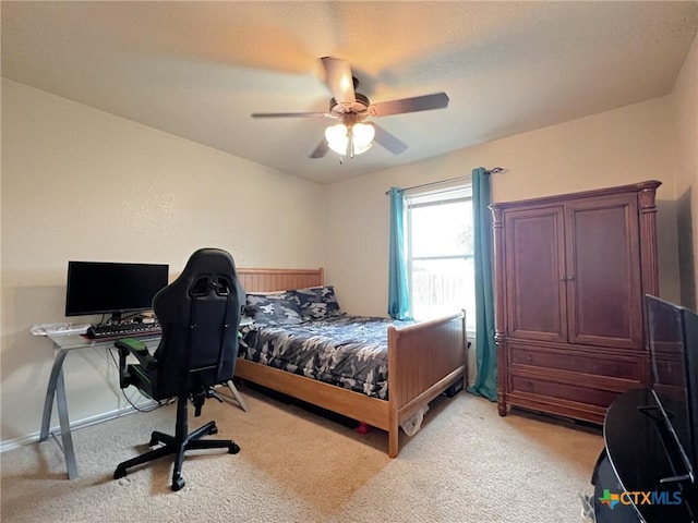 bedroom with ceiling fan and light colored carpet