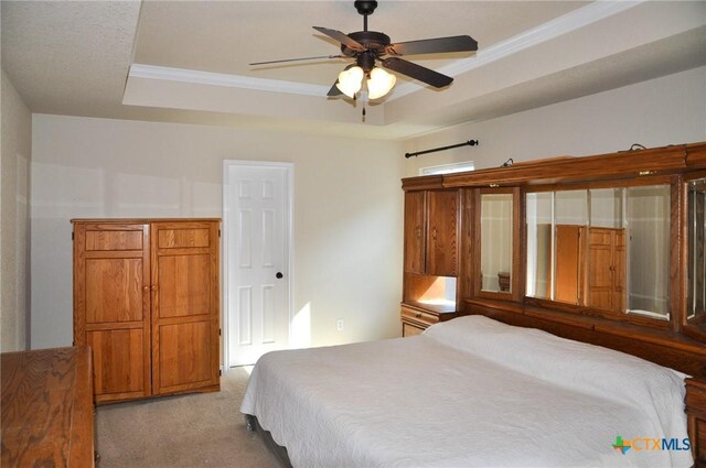 kitchen with kitchen peninsula, white appliances, pendant lighting, crown molding, and sink