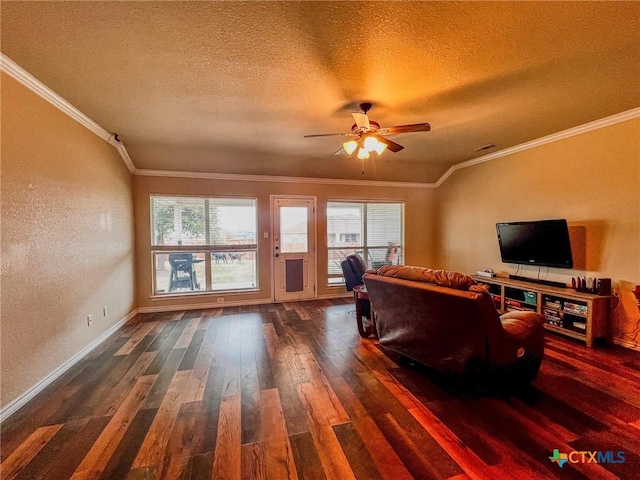 living room featuring lofted ceiling, a textured ceiling, a healthy amount of sunlight, and crown molding