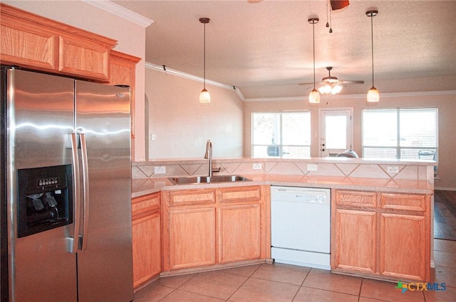 kitchen with sink, crown molding, white dishwasher, and stainless steel refrigerator with ice dispenser