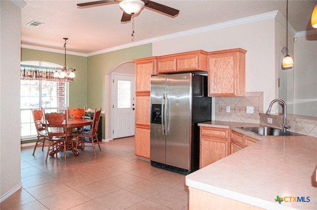 kitchen with sink, tasteful backsplash, light brown cabinetry, and stainless steel fridge with ice dispenser