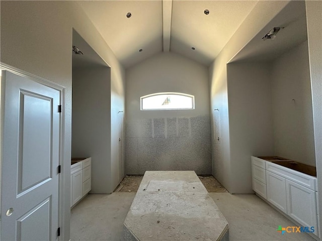 bathroom featuring vaulted ceiling