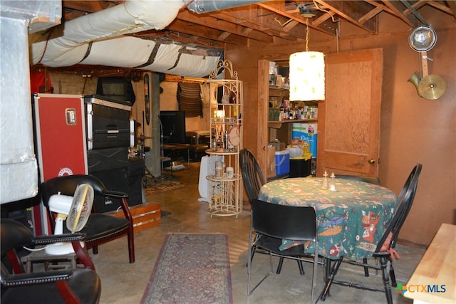 dining area with concrete flooring