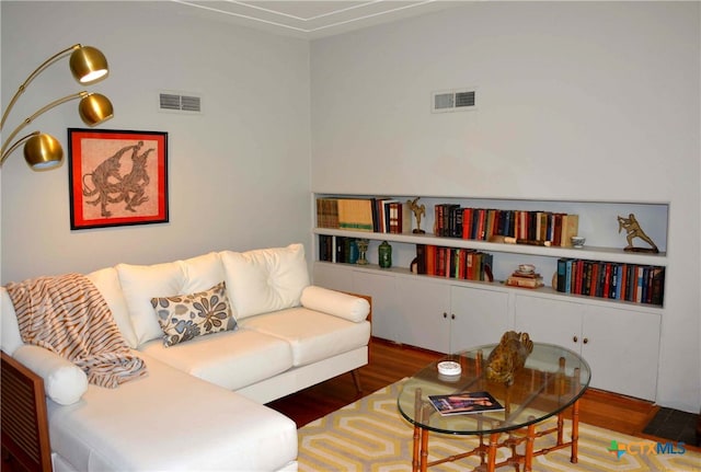 living room featuring dark wood-type flooring