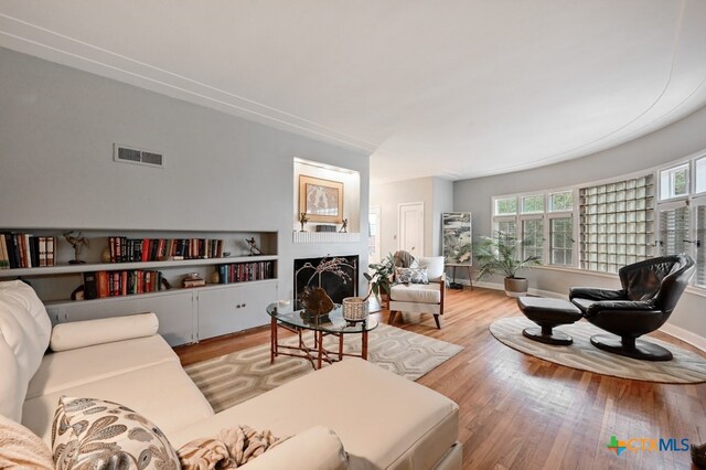 interior space with wood-type flooring and an inviting chandelier