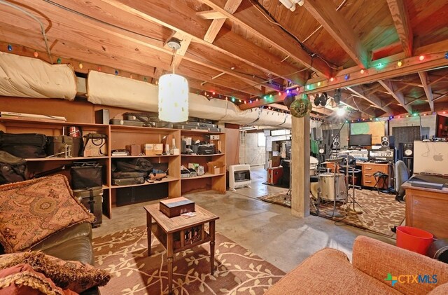 bedroom featuring ceiling fan, multiple windows, and carpet floors