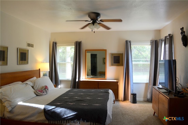 carpeted bedroom featuring ceiling fan