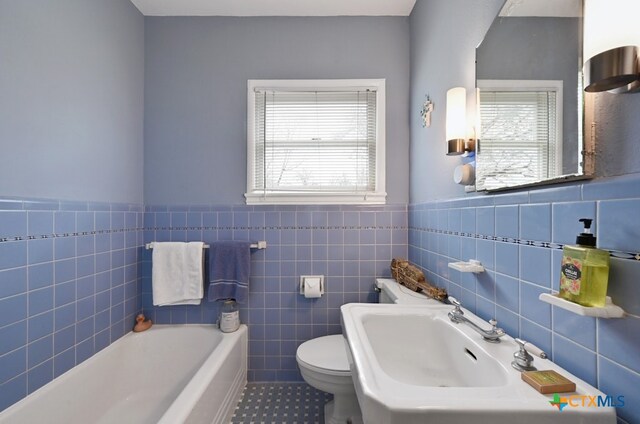 kitchen featuring blue cabinetry, stainless steel refrigerator with ice dispenser, and butcher block countertops