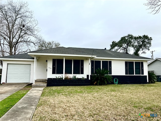 ranch-style house with a front lawn and a garage