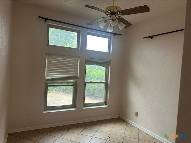 307 Illinois Dr, Harker Heights, TX 76548 - unfurnished room featuring light tile patterned floors, ceiling fan, and baseboards