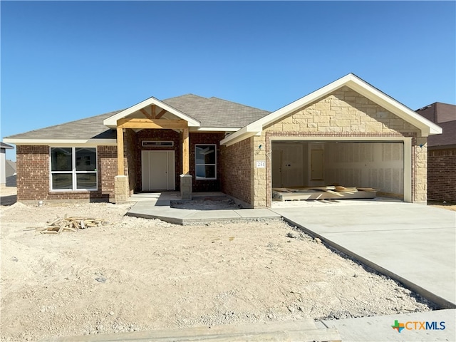 view of front of property featuring a garage