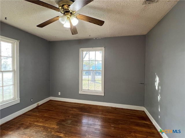 1215 S 47th St, Temple, TX 76504 - unfurnished room with wood-type flooring, a textured ceiling, baseboards, and ceiling fan