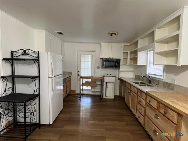 1215 S 47th St, Temple, TX 76504 - kitchen with freestanding refrigerator, a sink, open shelves, dark wood finished floors, and wooden counters