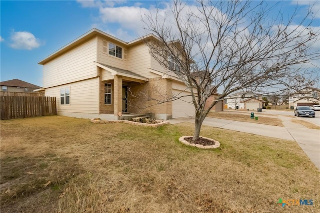 view of front of property with a garage and a front yard