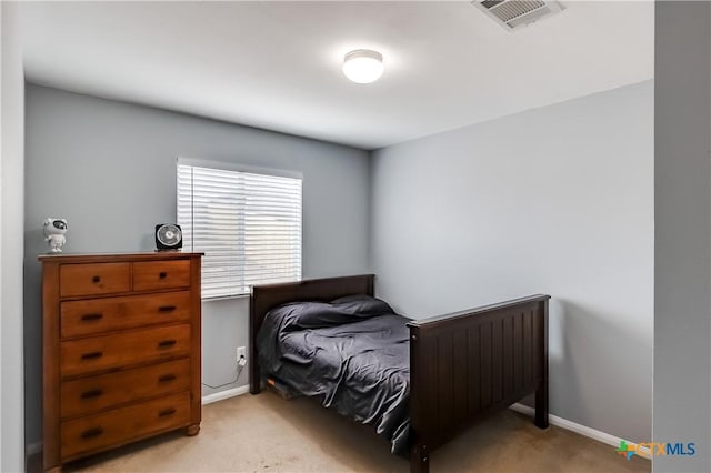 carpeted bedroom with radiator heating unit