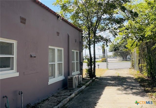 view of home's exterior with ac unit