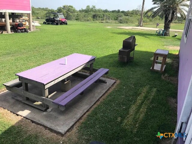 view of storm shelter with a lawn