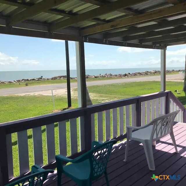 296 S Ocean Dr, Port Lavaca, TX 77979 - wooden deck featuring a water view and a yard